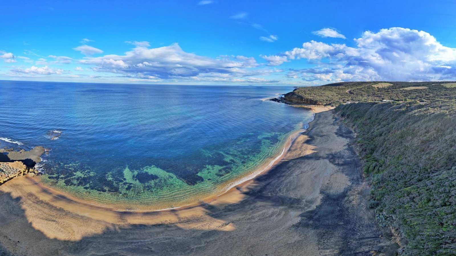 Two surfers at glassy Bells Beach, Winki Pop